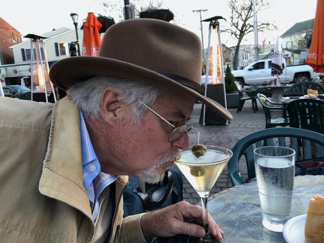 Man drinking martini