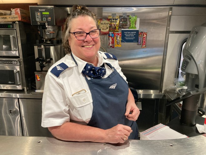 Woman behind counter in train diner