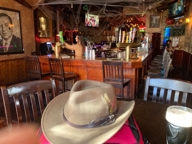 Old wood and raw brick walls enclose the bar at Dugan's Pub.