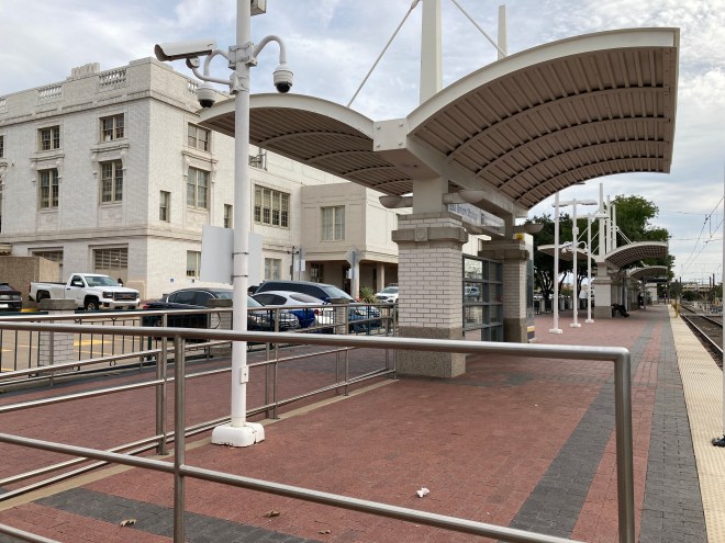 Boarding platform outside train station.