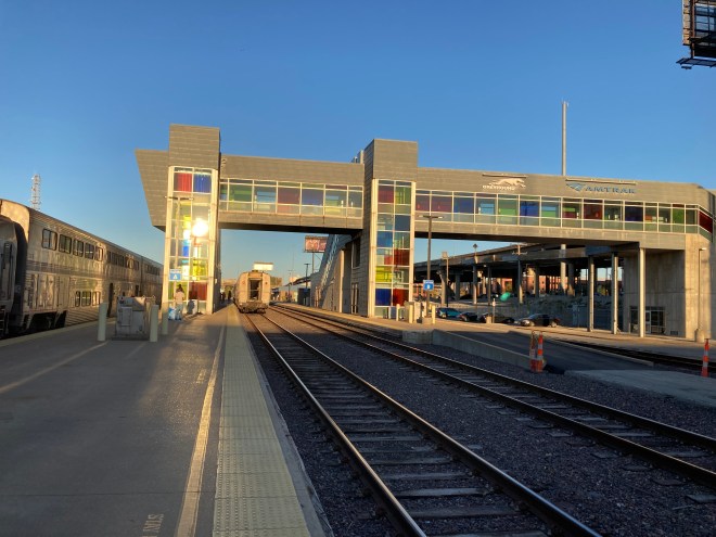 Train beside overhead walkway